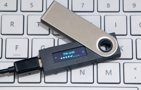 Cryptocurrency Hardware Wallet On Laptop Keyboard