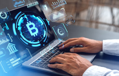 Man with laptop and bitcoin interface
